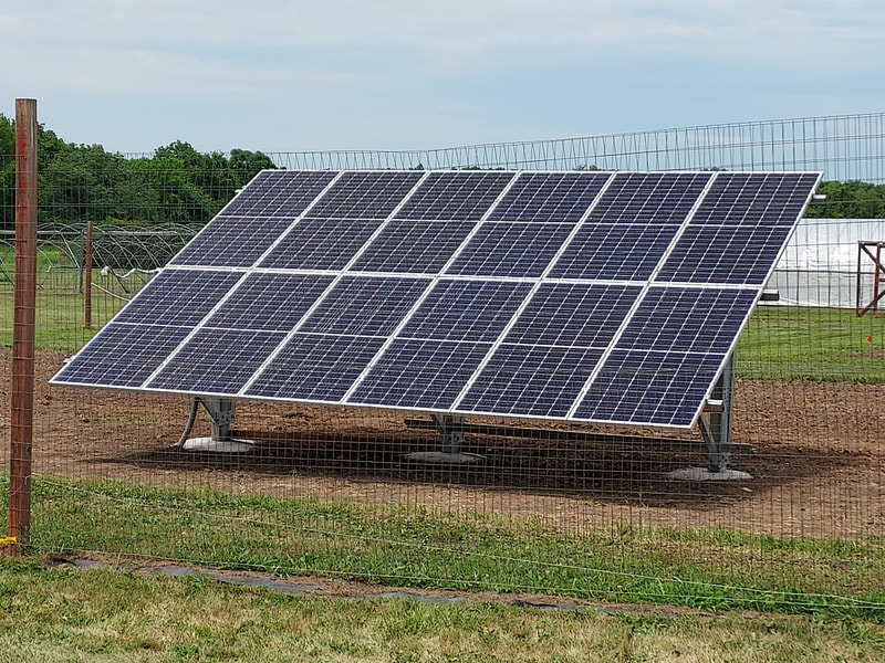 Solar array constructed over the summer provides renewable power for the irrigation and aerator pumps to water vegetable and turf research plots and keep the holding pond water circulating.