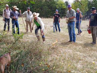Drew Ricketts, third from right, leads students in a controlled burn during Natural Resources Training at OHREC.